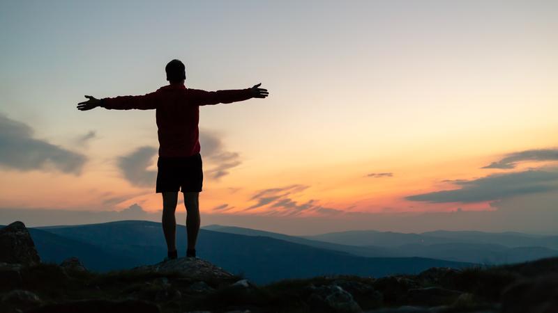 Man celebrating sunset